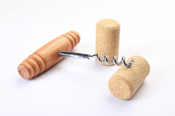 Canvas Print - Corkscrew with wooden handle and corks on white background