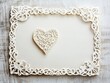 © Maetinee - Elegant handmade heart filigree greeting on white envelope for weddings