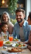 © natakot - A cheerful family enjoys a delightful meal together, radiating warmth and happiness. The scene captures a loving atmosphere with delicious food, laughter, and shared moments, highlighting the joy of