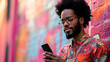 © mahamad - Portrait of a handsome Afro man using his mobile phone