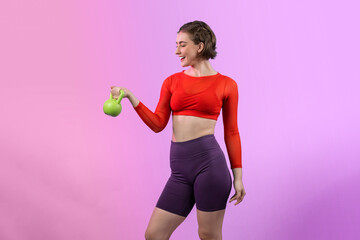 Full body length gaiety shot athletic and sporty woman with kettlebell for weight lifting as bodybuilding exercise in standing posture on isolated background. Healthy active and body care lifestyle