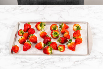 Wall Mural - Washed Strawberries Drying on a Paper Towel-Lined Baking Sheet