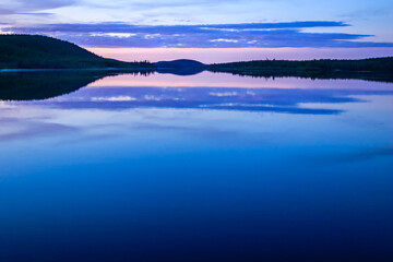 Wall Mural - a beautiful lake with a blue sky in the background