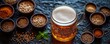 © Vadym - Light beer glass sits on dark surface with different spices, grains around. Top view shows craft beer, brewing concept. Various seasonings scattered. Fresh, flavorful. Brewing concept photo.