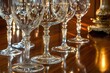 © Terry - Elegant crystal wine glasses gleam on a rich wood surface, reflecting warm light.  A sophisticated and luxurious still life.