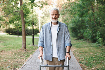 Senior man with walking frame in park