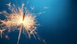 © Zachery - birthday celebration sparkler burning vibrant with sparks on blue background with replica area