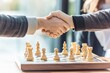 © Maria - vibrant action shot of two players shaking hands over chessboard after game their joy evident with background softly