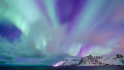 Wall Mural - aurora borealis in norway, lofoten islands. northern lights over the mountains. starry sky. winter l