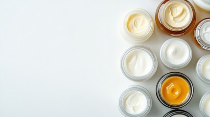 Wall Mural - overhead shot of collection of small dairy jars including cream and yogurt neatly arranged on white 