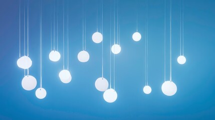 Leinwandbilder - Glowing orbs hang from thin strings against a blue backdrop.