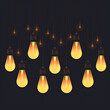 © svonidze - Glowing vintage light bulbs on dark