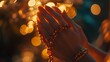© Raffanza - Night prayer hands rosary bokeh lights hope faith