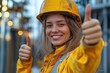 © Vadym - Happy female construction worker gives thumbs up outdoors. Confident woman in safety gear smiles proudly. Successful project achievement at work site. Positive, empowered woman in industry. Teamwork,