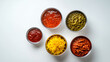 © thongsook - Indian street food spread with curry, biryani, and chutneys, styled on a minimalist white surface