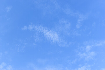 Wall Mural - beautiful blue sky and white fluffy group of clouds with sunrise in the morning, natural background