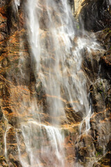 Wall Mural - A waterfall with a misty, blurry appearance