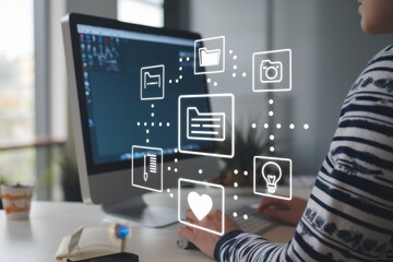 person working on computer with digital file icons