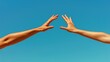 © grooveisintheheart - Two arms touching the sky. Gesture. Freedom. Support and connection between two people