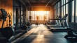© Nuttaya Nampai - Well-lit gym interior with multiple treadmills, stationary bikes, and strength machines, creating a vibrant and organized fitness area