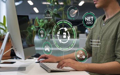 Person working on computer displays net zero sustainable development