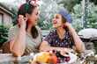 © Austockphoto - Mother and son playing with fresh berries on the table
