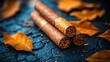© zeni - Three cigars resting on dried leaves.