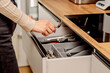 © eugenivy - Opening a drawer with cutlery