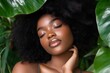 © senyumanmu - Serene Black Woman with Afro Surrounded by Lush Green Leaves