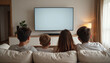 © AlenaSi - Family watching TV on a cozy sofa in a modern living room