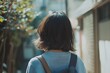 © senyumanmu - Woman Walking Away  Short Hair  Backpack  City Street