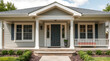 © MatandSterre - Dream House Exterior: Charming Gray Home with Classic Porch and Landscaping