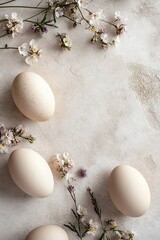 Wall Mural - Calm and elegant background showcasing neutral-toned Easter eggs scattered among delicate wildflowers on a smooth stone surface