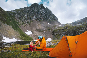 Wall Mural - family camping in mountains - father and kid traveling with tent gear travel vacations dad and daugh