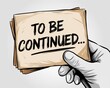 © Media Srock - A Hand Holds Papers Announcing To Be Continued