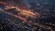 © Arora Chan - Aerial View of Intense Wildfire Threatening Residential Areas at Night