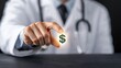 © VANATSANUN - A doctor holding a dollar sign symbolizing financial success in healthcare.
