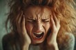© Michael - Portrait of a desperate woman screaming and holding her head, suffering from a headache or a mental breakdown