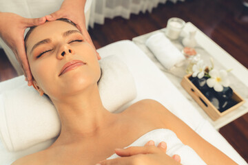 caucasian woman enjoying relaxing anti-stress head massage and pampering facial beauty skin recreati