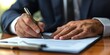 © LukaszDesign - Close-up of hands and a professional with documents, signing and reviewing paperwork, including contracts and policies