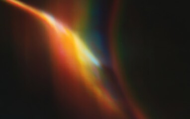 Wall Mural - radiant light spectrum over black background with lens flare effects in high detail