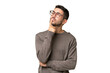 © luismolinero - Young handsome caucasian man over isolated background having doubts while looking up