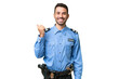 © luismolinero - Young police caucasian man over isolated background pointing to the side to present a product