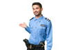 © luismolinero - Young police caucasian man over isolated background extending hands to the side for inviting to come