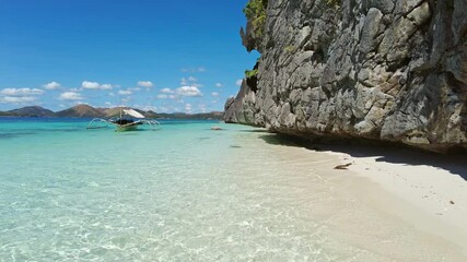 Wall Mural - beautiful view of tropical philippines island. white sand beach and boat in bay with turquoise water