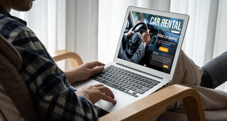 Wall Mural - car rental website on computer screen for tourist to rent a car for transportation snugly