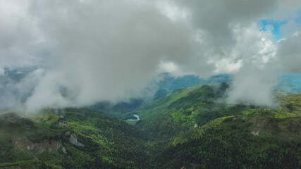 Wall Mural - aerial view of clouds over summer green mountains landscape, montenegro, 4k