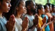 © Viktor - Diverse group meditates together with closed eyes. People pray in unity. Multi-cultural group shares faith, spirituality. Inner peace, harmony concept. Spiritual gathering indoors. Focus on oneness,