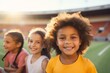 © nsit0108 - Happy multiethnic children smiling in a stadium, promoting diversity, inclusion, and children's participation in sports