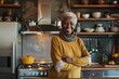 © Vorda Berge - Portrait of a happy senior African American woman in modern kitchen